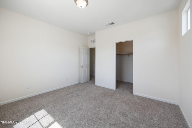 14144 American Pillar Ct, Reno, NV 89511 - unfurnished bedroom with light carpet, a spacious closet, and a closet