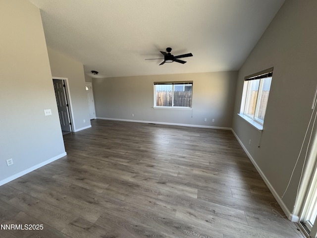 8 Conner Way, Gardnerville, NV 89410 - empty room featuring plenty of natural light, a ceiling fan, lofted ceiling, and dark wood finished floors