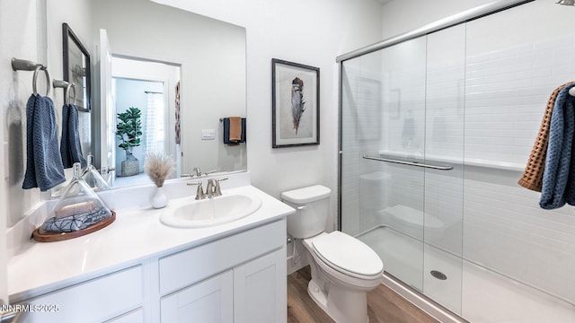 7602 Apex Pl # 106, Reno, NV 89506 - full bathroom featuring vanity, wood finished floors, and a stall shower