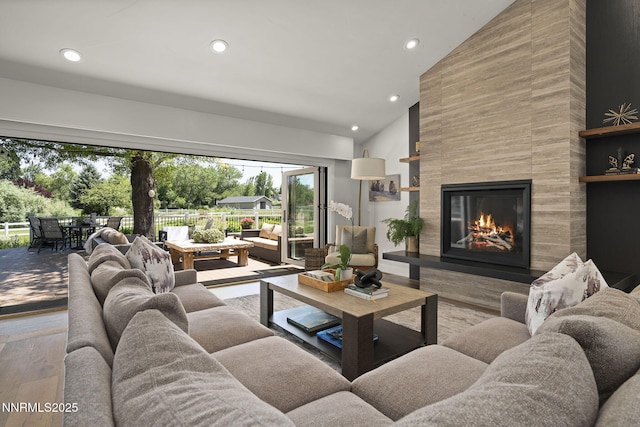 10594 Dixon Ln, Reno, NV 89511 - living area with high vaulted ceiling, hardwood / wood-style flooring, recessed lighting, and a premium fireplace