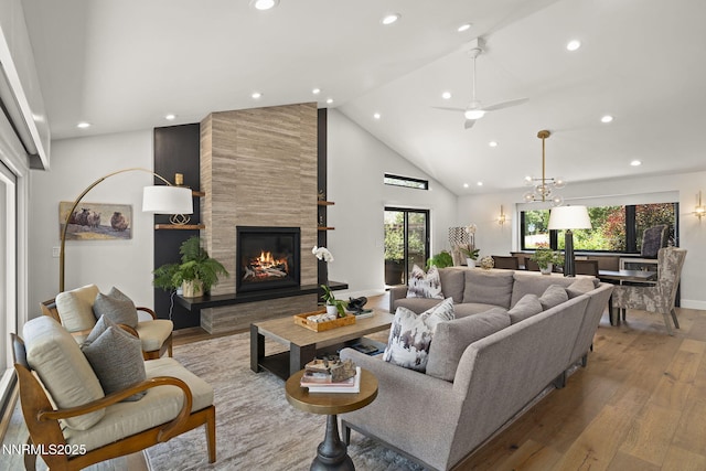 10594 Dixon Ln, Reno, NV 89511 - living area featuring wood finished floors, recessed lighting, a tile fireplace, high vaulted ceiling, and ceiling fan
