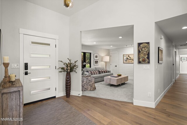 10594 Dixon Ln, Reno, NV 89511 - entryway with wood finished floors, recessed lighting, and a high ceiling