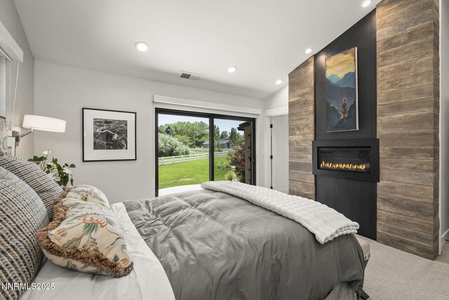 10594 Dixon Ln, Reno, NV 89511 - carpeted bedroom featuring a fireplace, vaulted ceiling, recessed lighting, and access to outside