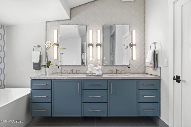 10594 Dixon Ln, Reno, NV 89511 - full bath with double vanity, a freestanding tub, decorative backsplash, and tile patterned flooring
