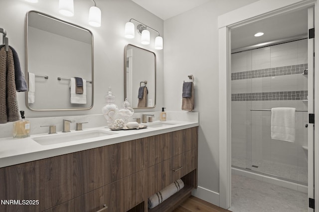 10594 Dixon Ln, Reno, NV 89511 - bathroom featuring double vanity, a shower stall, and recessed lighting