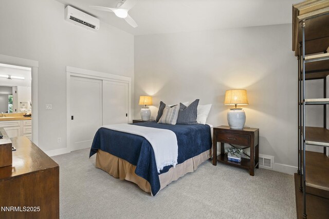 10594 Dixon Ln, Reno, NV 89511 - bedroom featuring a wall mounted AC, light carpet, a closet, and ceiling fan