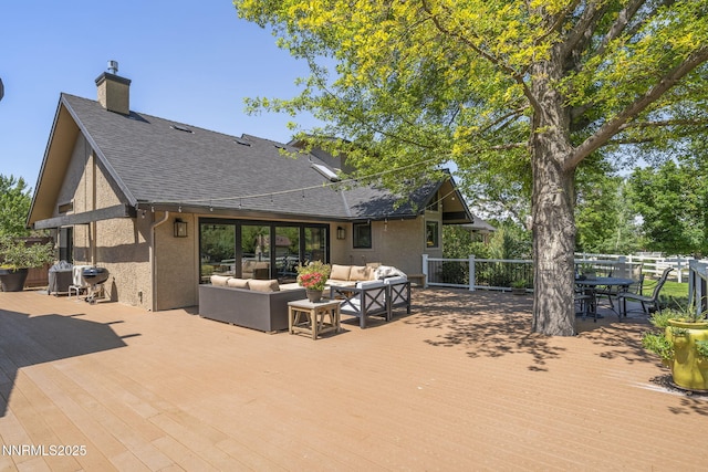 10594 Dixon Ln, Reno, NV 89511 - wooden deck with outdoor lounge area, outdoor dining space, and a grill