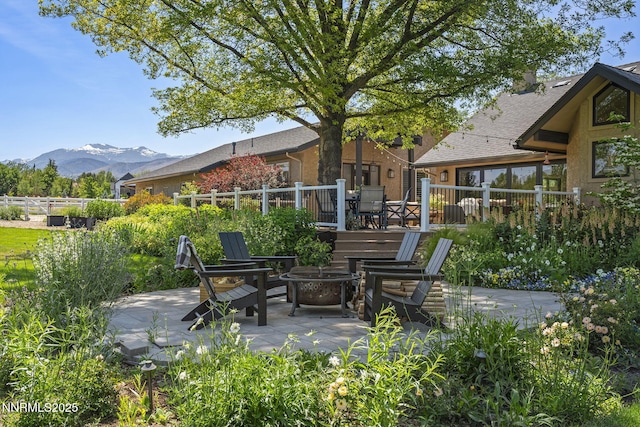 10594 Dixon Ln, Reno, NV 89511 - view of patio / terrace featuring a fire pit and a mountain view