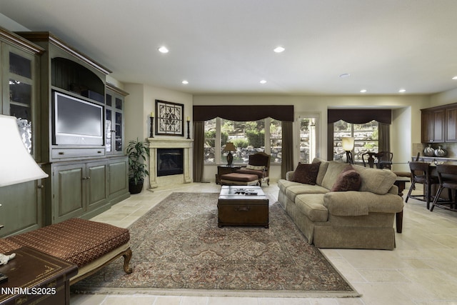 4485 Bathgate Ct, Reno, NV 89519 - living area featuring recessed lighting, a fireplace, and stone tile floors