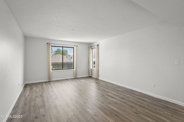 3095 Lakeside Unit 203, Reno, NV 89509 - spare room with wood finished floors and a textured ceiling