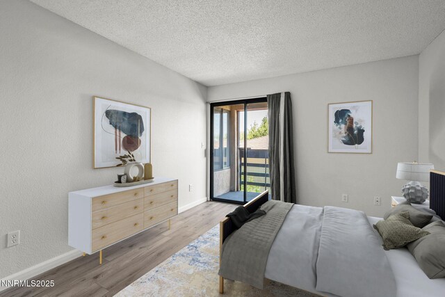3095 Lakeside Unit 203, Reno, NV 89509 - bedroom with access to exterior, light wood-type flooring, and a textured ceiling