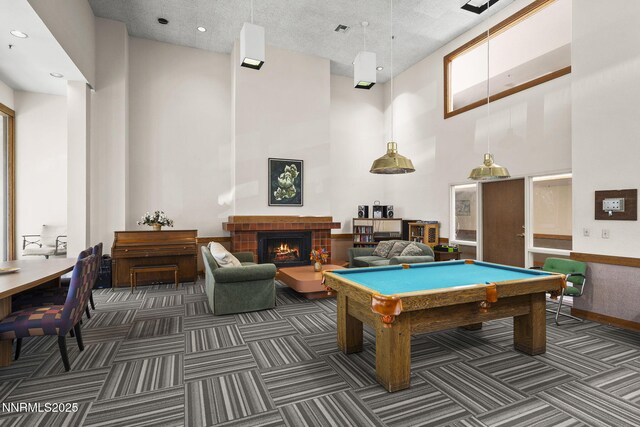 3095 Lakeside Unit 203, Reno, NV 89509 - rec room with a towering ceiling, carpet, billiards, and a brick fireplace