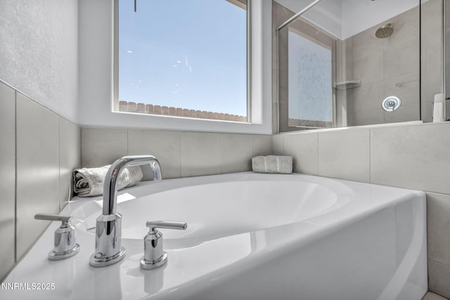1250 Hubble Ln, Carson City, NV 89705 - full bathroom featuring a bath and tiled shower