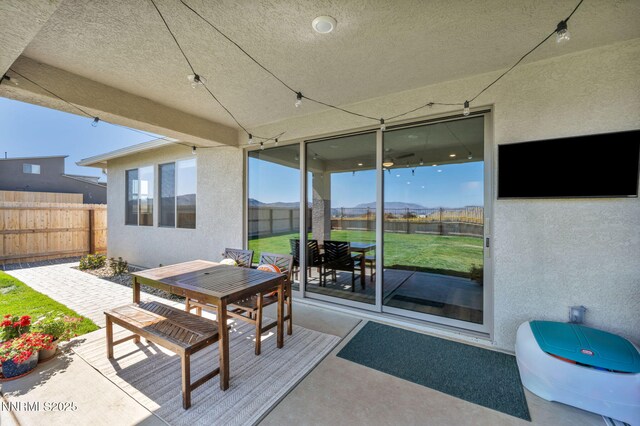 1250 Hubble Ln, Carson City, NV 89705 - fenced backyard featuring outdoor dining space and a patio