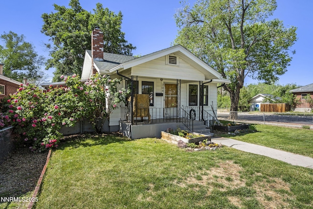 704 Roberts St, Reno, NV 89502 - view of front of home featuring covered porch and a chimney