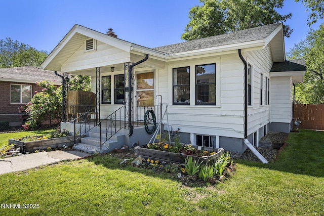 704 Roberts St, Reno, NV 89502 - view of front of house featuring a chimney and a shingled roof