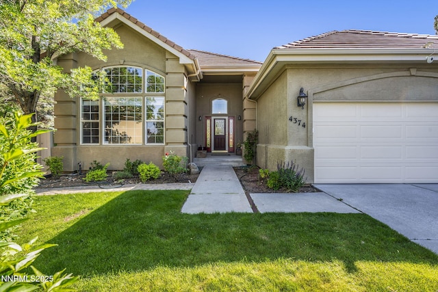 4374 Cullen Ct, Reno, NV 89519 - property entrance with a lawn, an attached garage, stucco siding, and a tile roof