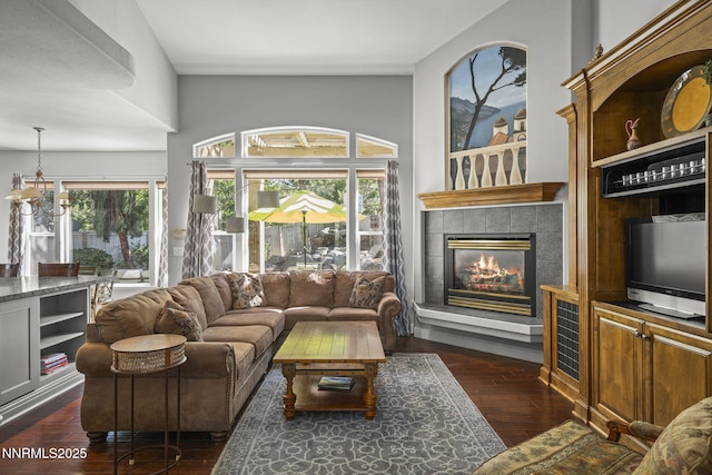 4374 Cullen Ct, Reno, NV 89519 - living room featuring dark wood-style floors and a tiled fireplace