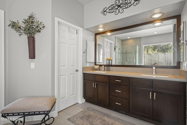 4374 Cullen Ct, Reno, NV 89519 - bathroom with double vanity, a tile shower, and wood finished floors