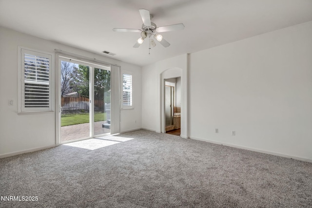 6469 Hale Bopp Ct, Sparks, NV 89436 - carpeted empty room featuring arched walkways and a ceiling fan