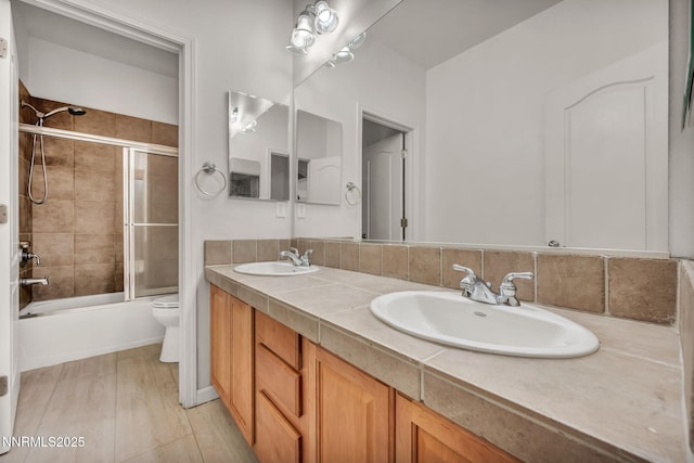6469 Hale Bopp Ct, Sparks, NV 89436 - bathroom featuring double vanity, shower / bath combination with glass door, and wood finished floors