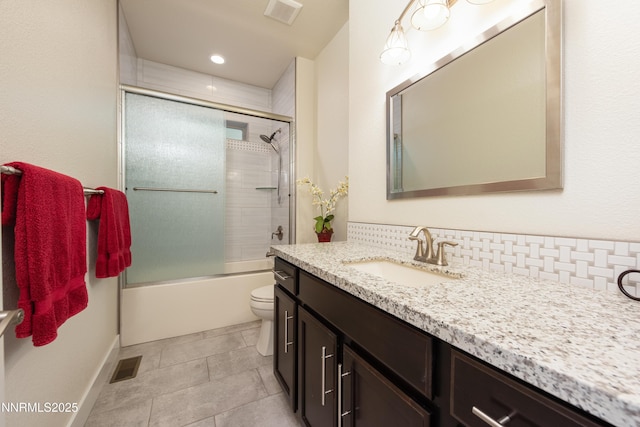 113 Denio Dr, Dayton, NV 89403 - bathroom with vanity, combined bath / shower with glass door, tile patterned floors, and tasteful backsplash