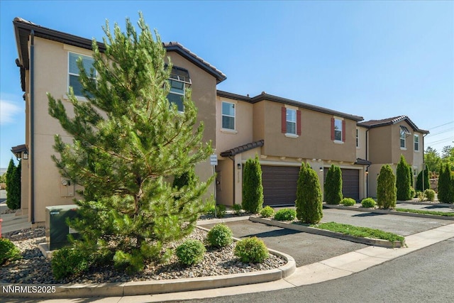2170 Santona Cir, Reno, NV 89523 - townhome / multi-family property with stucco siding, driveway, and a garage