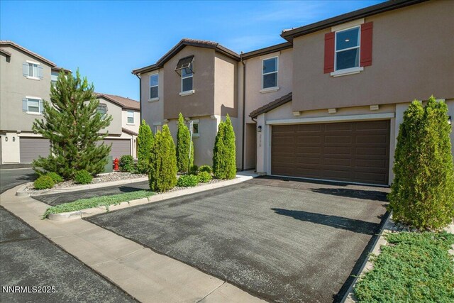 2170 Santona Cir, Reno, NV 89523 - view of front of property featuring a garage, stucco siding, and asphalt driveway