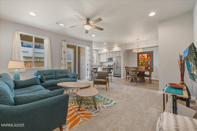 2170 Santona Cir, Reno, NV 89523 - living room featuring a ceiling fan, recessed lighting, plenty of natural light, and light colored carpet