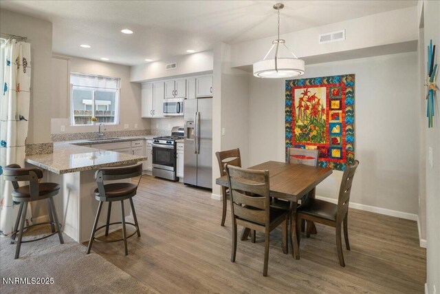 2170 Santona Cir, Reno, NV 89523 - dining area featuring light wood-style flooring and recessed lighting