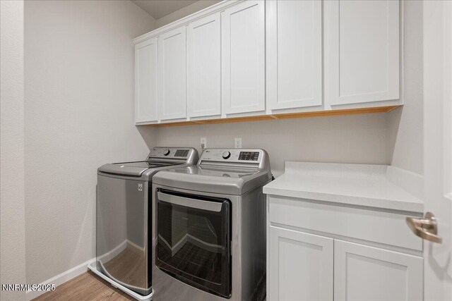 2170 Santona Cir, Reno, NV 89523 - laundry area featuring cabinet space, washer and dryer, and wood finished floors