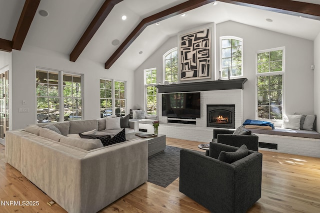 5830 Strasbourg Ct, Reno, NV 89511 - living area featuring a brick fireplace, beam ceiling, light wood-type flooring, recessed lighting, and high vaulted ceiling