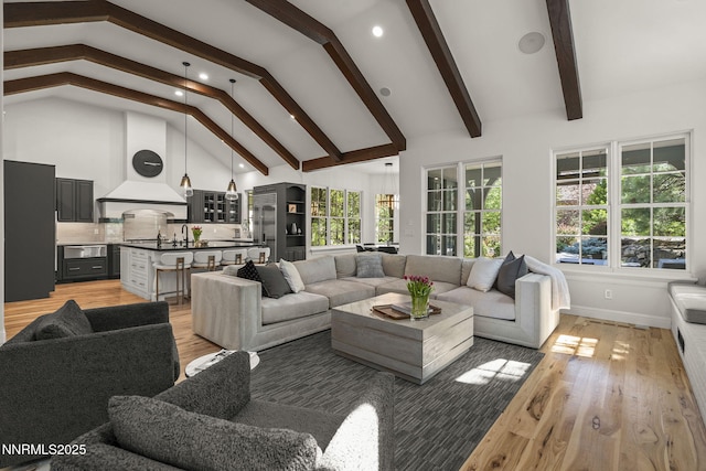 5830 Strasbourg Ct, Reno, NV 89511 - living area with high vaulted ceiling, beamed ceiling, light wood-type flooring, and recessed lighting