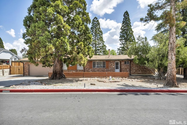 3430 Gwynelle Ct, Sparks, NV 89431 - view of front facade featuring brick siding, driveway, and an attached garage