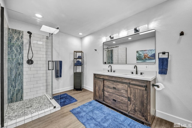 3430 Gwynelle Ct, Sparks, NV 89431 - full bathroom with a shower stall, wood finished floors, double vanity, and recessed lighting