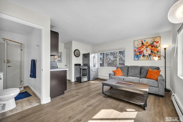 3430 Gwynelle Ct, Sparks, NV 89431 - living room with a baseboard heating unit and light wood-style flooring