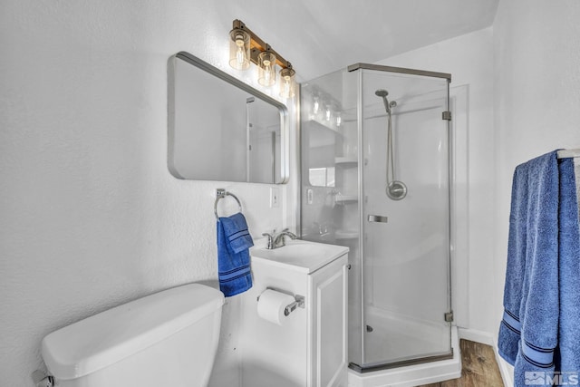 3430 Gwynelle Ct, Sparks, NV 89431 - bathroom featuring a stall shower, vanity, and wood finished floors