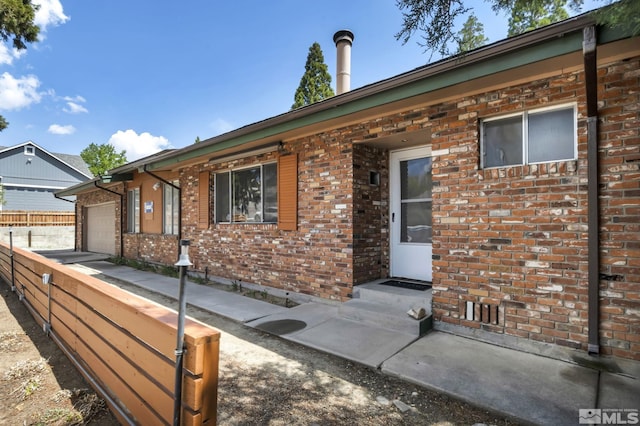 3430 Gwynelle Ct, Sparks, NV 89431 - view of front of house featuring brick siding and a garage
