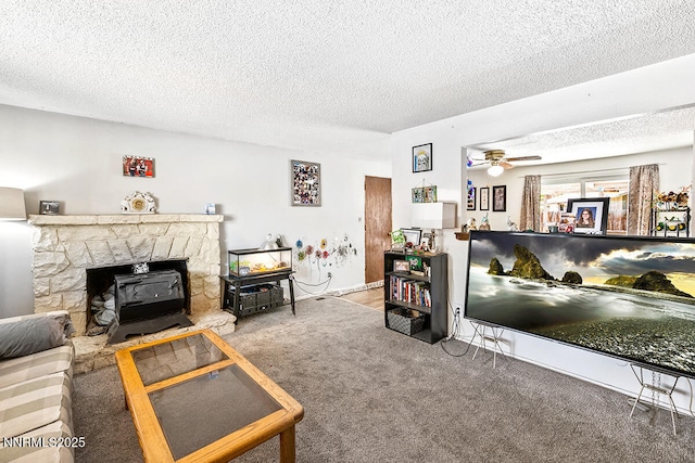 1009 E Robinson St, Carson City, NV 89701 - living area with carpet, a wood stove, ceiling fan, and a textured ceiling