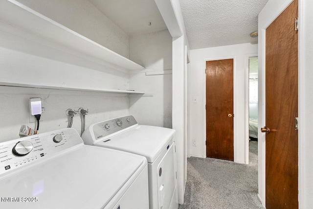 1009 E Robinson St, Carson City, NV 89701 - laundry room featuring washing machine and clothes dryer, light colored carpet, and a textured ceiling