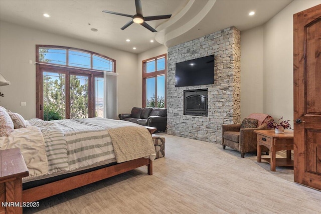 2550 Old Waverly Ct, Sparks, NV 89436 - bedroom with recessed lighting, a stone fireplace, and access to outside