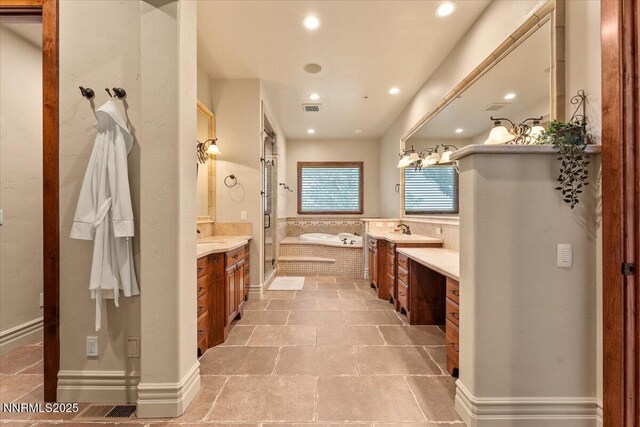 2550 Old Waverly Ct, Sparks, NV 89436 - bathroom featuring two vanities, a bath, and recessed lighting