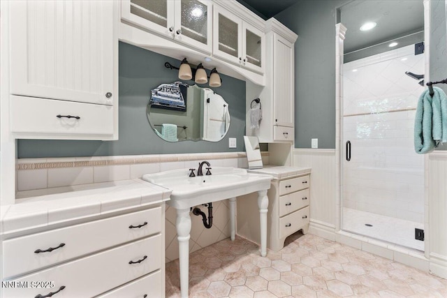 2550 Old Waverly Ct, Sparks, NV 89436 - bathroom featuring a stall shower, a wainscoted wall, and tile patterned flooring
