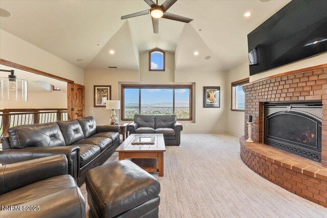 2550 Old Waverly Ct, Sparks, NV 89436 - living room featuring ceiling fan, a fireplace, high vaulted ceiling, wood finished floors, and recessed lighting