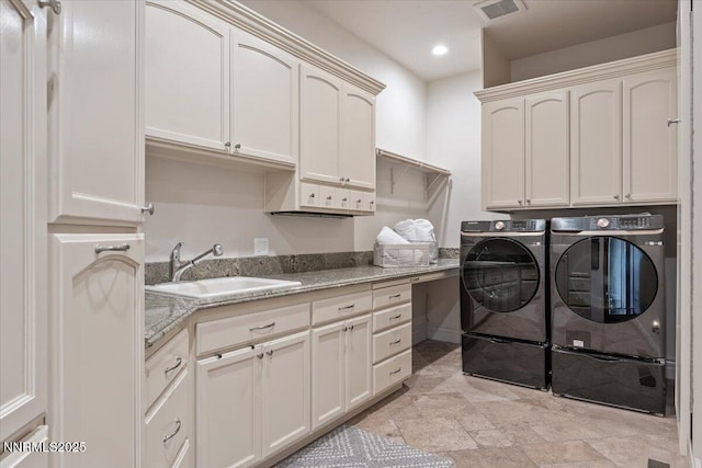 2550 Old Waverly Ct, Sparks, NV 89436 - laundry area with cabinet space, washing machine and dryer, recessed lighting, and light stone finish floors