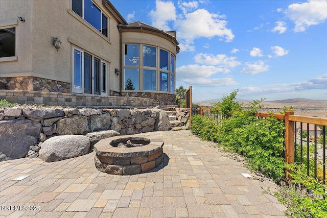 2550 Old Waverly Ct, Sparks, NV 89436 - view of patio with a fire pit and a mountain view