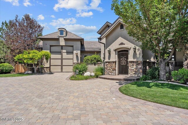 2550 Old Waverly Ct, Sparks, NV 89436 - french country inspired facade with stone siding, driveway, a garage, and stucco siding