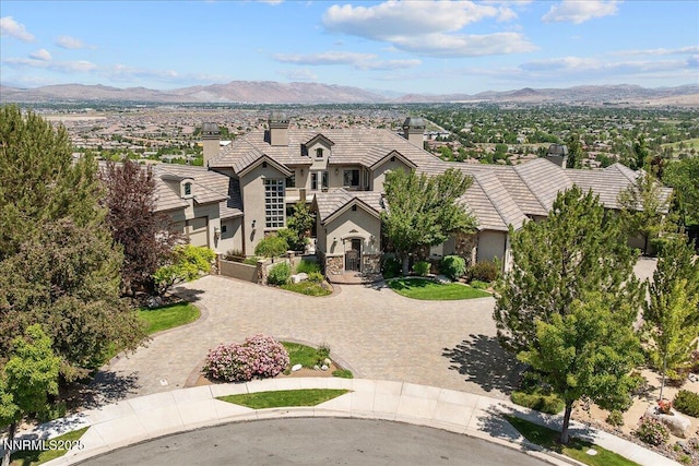 2550 Old Waverly Ct, Sparks, NV 89436 - french country home with stucco siding, a mountain view, and a tiled roof