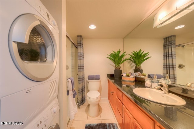 450 N Arlington Ave Unit 715, Reno, NV 89503 - full bathroom featuring stacked washer / drying machine, vanity, tile patterned flooring, a shower with shower curtain, and recessed lighting