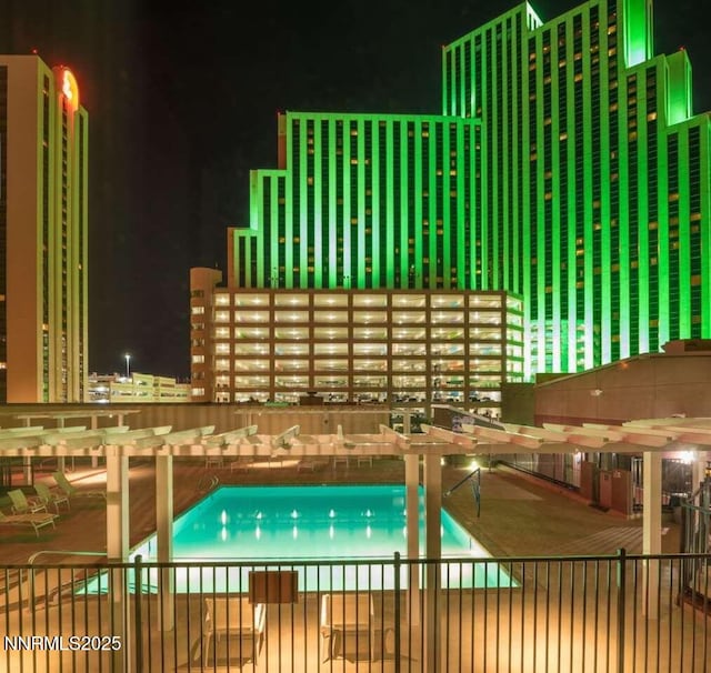 450 N Arlington Ave Unit 715, Reno, NV 89503 - pool at twilight featuring a pergola, a community pool, and a patio